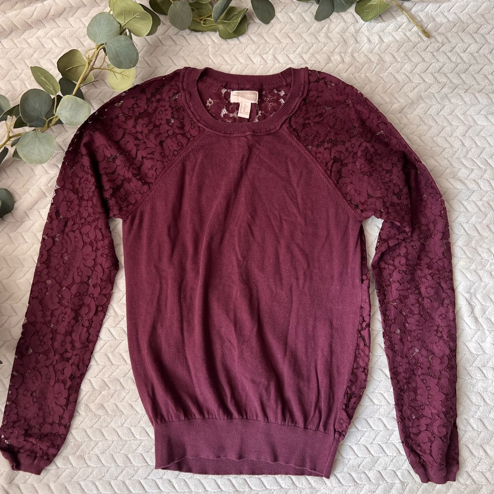 Maroon sweater with lace sleeves and back.